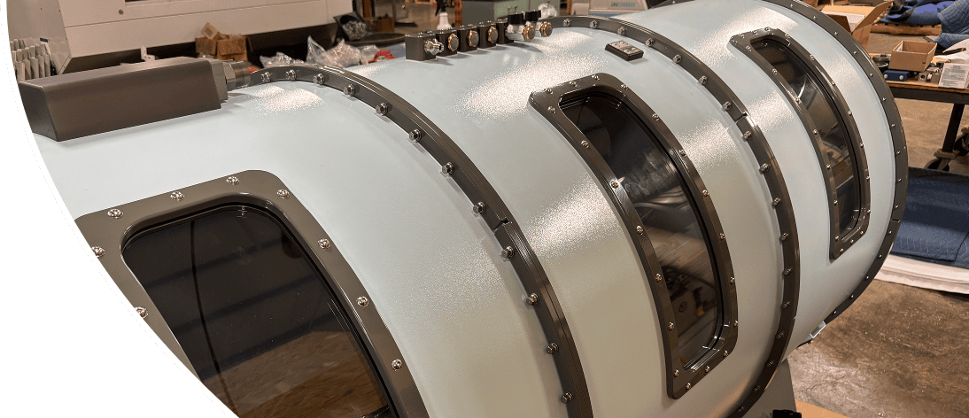 Industrial cylindrical chamber with multiple windows.