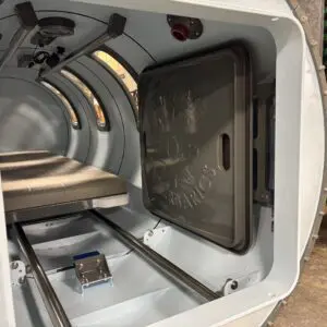 Interior of a cylindrical metal chamber.
